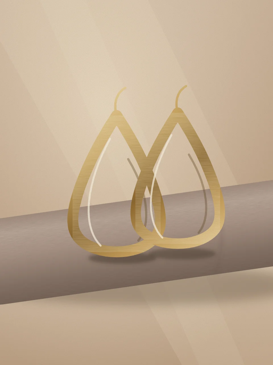 Sculptural gold-tone drop earrings arranged on linen